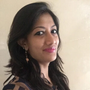 Megha Mundra, a student of immersion program squad #1, 2018 batch, smiling at the camera in casual attire.