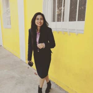 Christabel Sanjana, a student of immersion program squad #1, 2017 batch, smiling at the camera in professional attire.